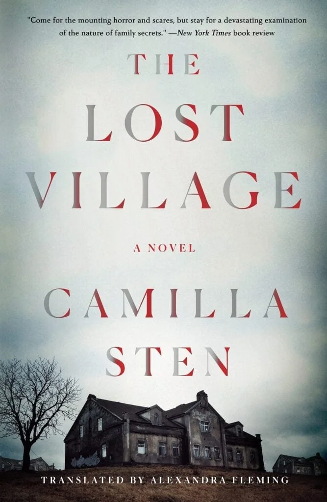 Front cover of the novel The Lost Village by Camilla Sten. An old school and a barren tree under a gray, cloudy sky.